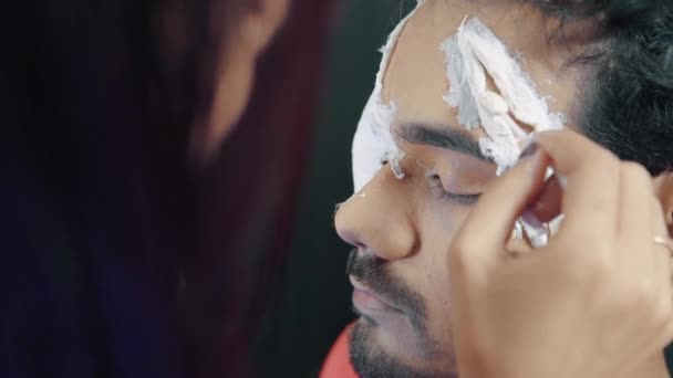 Make Artist Applying White Prosthetic Insert Man Face Make Halloween — Vídeo de Stock