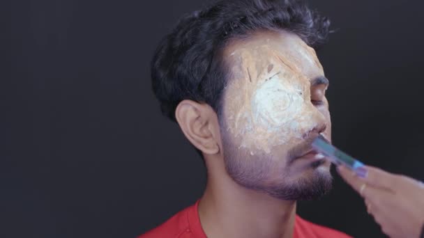 Professional Make Artist Doing Halloween Mask Man Face Close — Video Stock