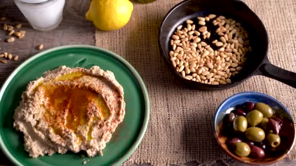 High Angle Slide Left Middle Eastern Food Spread Hummus Pine — Stock video