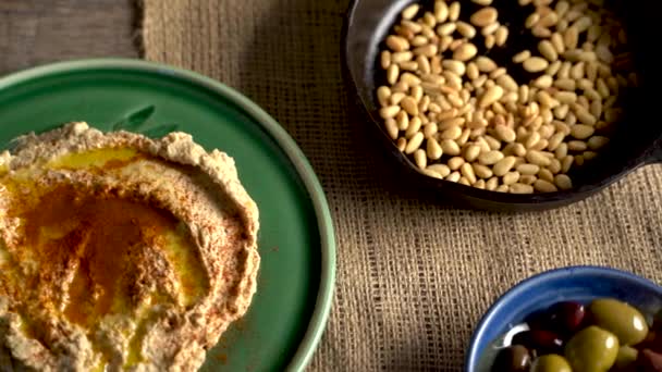 High Angle Slide Left Middle Eastern Food Spread Hummus Pine — Stockvideo