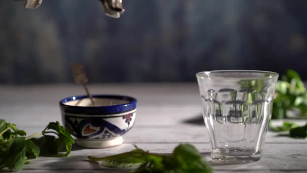 Slow Motion Tight Shot Hand Picking Ornate Teapot Pours Tea — Stockvideo