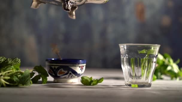 Slow Motion Wide Shot Hand Picking Ornate Teapot Pours Tea — Stockvideo