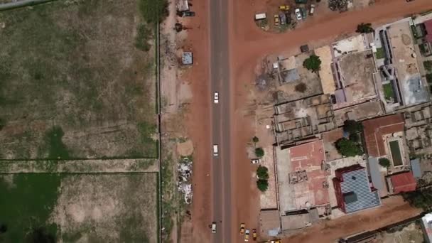 Aerial Bird Eye View Tracking White Van Kololi Road Serrekunda — Stockvideo