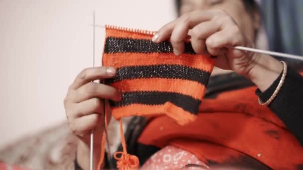 Traditional Indian Woman Watching Hew Knit Continues Knitting Black Red — Stockvideo