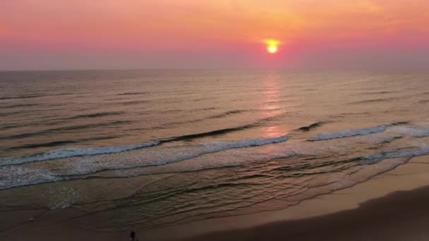 Pink Purple Sunrise Ocean Waves Breaking Beach One Person Walking — Video
