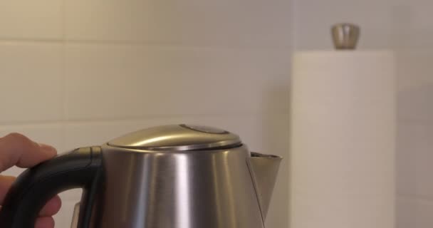 Water Being Poured Black Water Bottle Kettle Boiled Slow Motion — Stockvideo