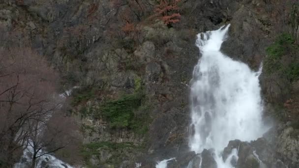 Tall Powerful Waterfall Rocky Autumn Forest Hill Pan Right — Wideo stockowe