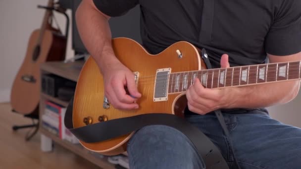 Young Man Playing Expensive Guitar Nice Black Stool Second Guitar — Stok Video