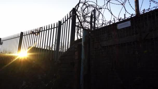Sunset Razor Wired Fence Barbed Wire Security Gate Old Abandoned — Vídeos de Stock
