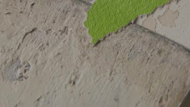 Steady Close Shot Man Scraping Green Paint Wall Renovations — Stockvideo