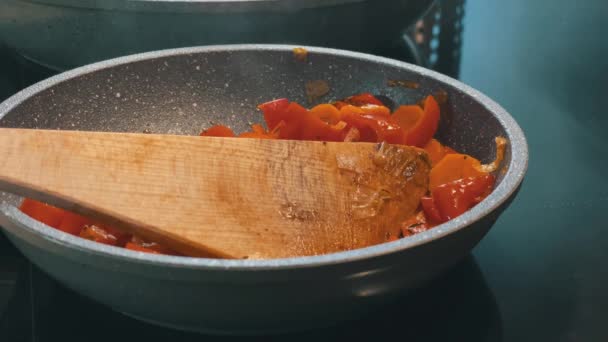 Steam Rises Pan Cooking Peppers Carrots Wooden Spatula — Video