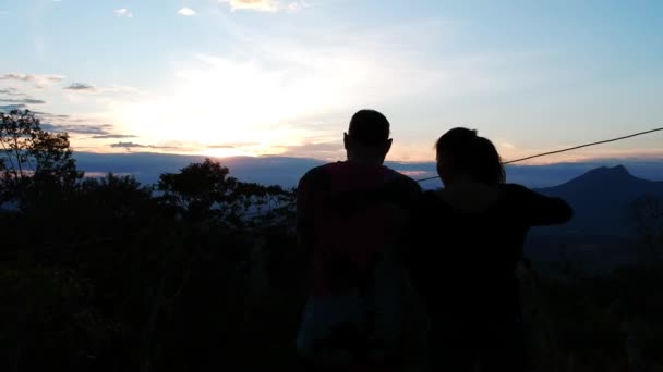 Beautiful Aerial View Couple Looking Horizon Dusk Hour Backlight Shot — Wideo stockowe