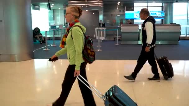 Side Shot Mature Woman Walking Airport Her Carry Luggage — Stockvideo
