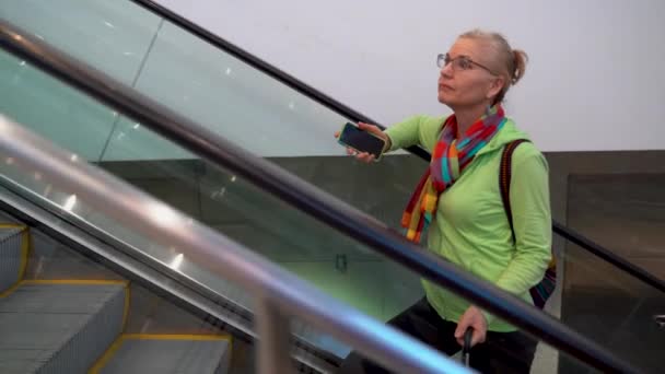 Side Shot Closeup Woman Going Escalator Smartphone Hand Roll Luggage — Stockvideo