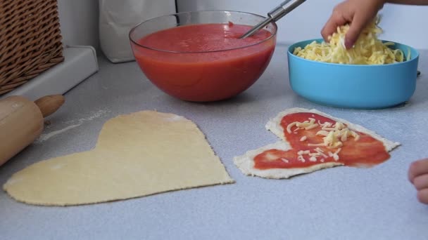 Little Young Girl Hand Sprinkles Mozzarella Cheese Heart Shape Pizza — Wideo stockowe