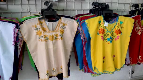 Camera Moving Right Panning Left Showing Colorful Designer Huipil Blouses — Wideo stockowe