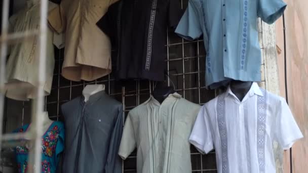 Camera Pans Showing Assortment Street Vendors Display Guayabera Mens Shirts — ストック動画