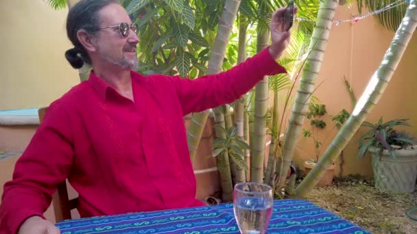 Closeup Mature Man Wearing Guayabera Shirt Takes Selfie Garden Computer — 图库视频影像
