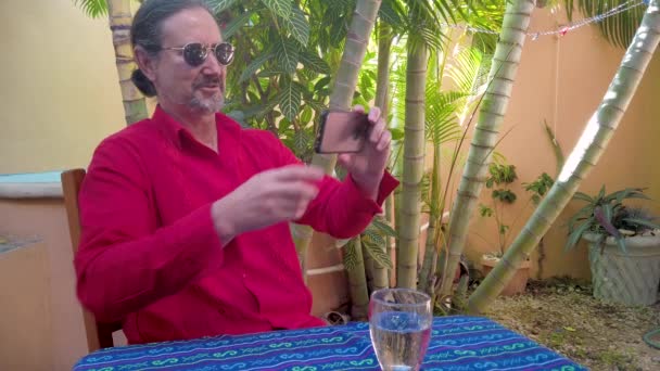 Closeup Mature Man Talking Someone Smartphone Shows His Guayabera Shirt — Video