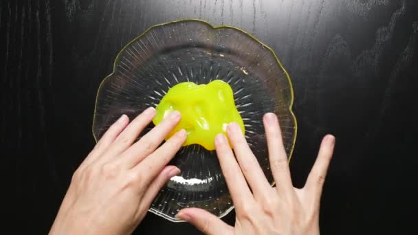 Playing Yellow Slime Bobble Glass Bowl — Vídeo de Stock