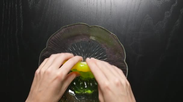 Female Fingers Kneading Yellow Transparent Slime Glass Bowl — ストック動画