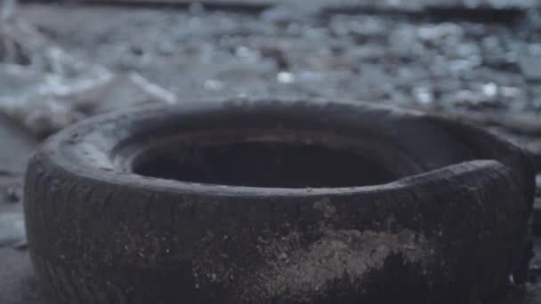 Old Black Tire Dumped Dirty Grunge Building — Stock video