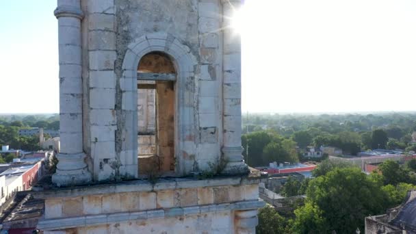 Aerial Extreme Closeup Backlit Bell Tower Sun Glinting Edge Camera — Stockvideo