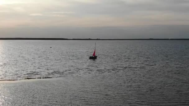 Aerial View Silhouetted Sailboat Anchored River Early Evening — Stock video