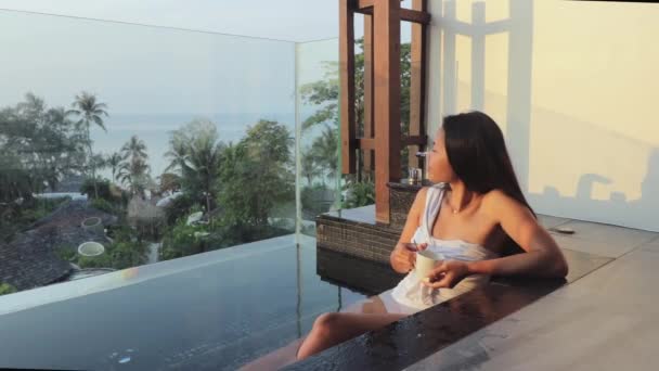 Young Girl Enjoying Bath Balcony Luxurious Hotel Holding Cup Coffee — Wideo stockowe