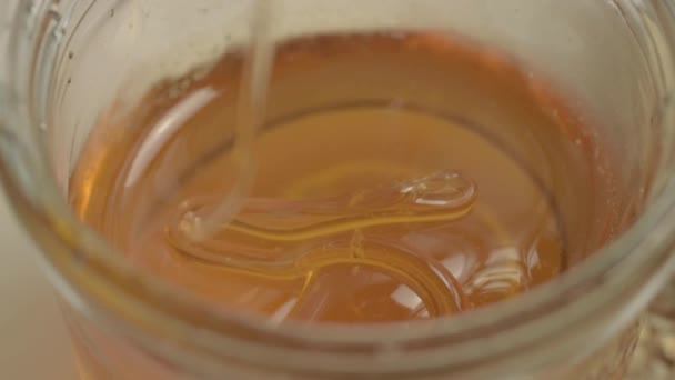 Clear Golden Runny Honey Dripping Jar Close — Wideo stockowe