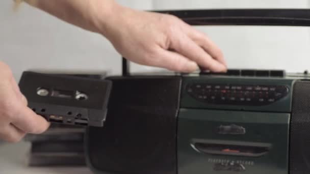 Hand Inserting Retro Cassette Tapes Radio Cassette Player Wide Shot — Stockvideo