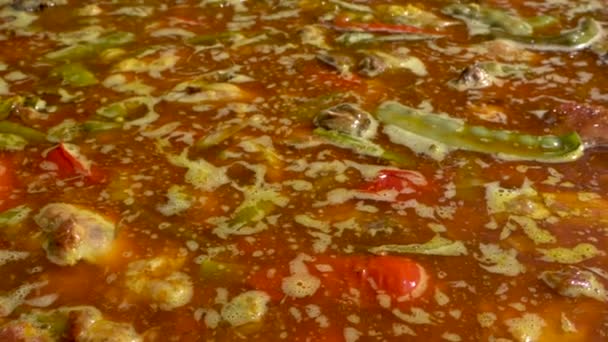 Close Shot Spanish Paella Being Cooked Panning Right Left Slow — Stockvideo