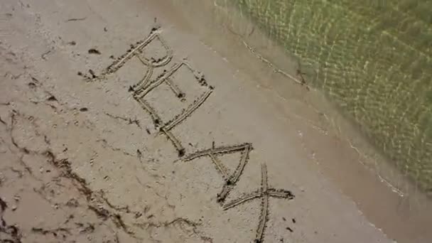 Relax Written Sand Spinning Clockwise — Stok video