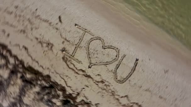 Love Written Sand Spinning Clockwise Showing Crazy Emotion — Stockvideo