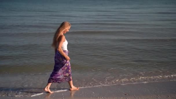 Slow Motion Mature Woman Sarong Walking Beach Splashing Water Sunrise — Wideo stockowe