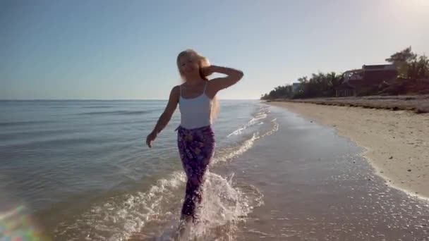 Pretty Carefree Woman Sarong Tank Top Splashing Water Walking Beach — Stockvideo