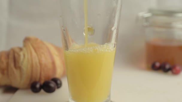 Pouring Fresh Orange Juice Breakfast Honey Croissants — Stock videók