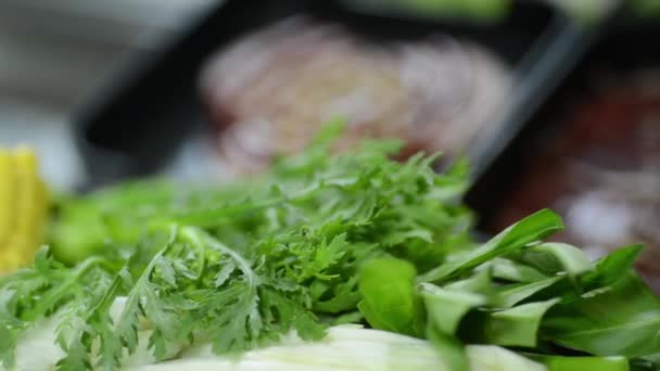 Preparing Delicious Soup Meat Green Leafy Ingredients Closeup Shot — Stockvideo