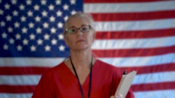 Portrait Nurse Walking Flag Foreground Showing Smile Approval — Stock Video