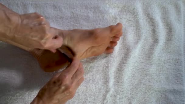 Using Gua Sha Tool Woman Rubs Scrapes Bottom Her Foot — Vídeo de Stock