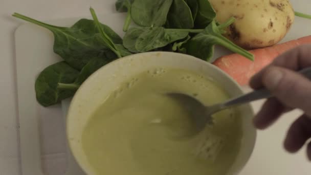 Hand Stirring Healthy Vegetable Soup Bowl Vegetables Background Close — Vídeo de stock