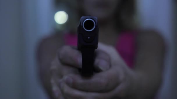 Young Woman Pointing Gun Target Hallway Background Selective Focus Front — Vídeo de Stock