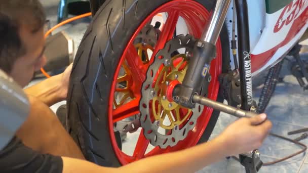 Technician Working Wheel Rim Installation Motorcycle — Video