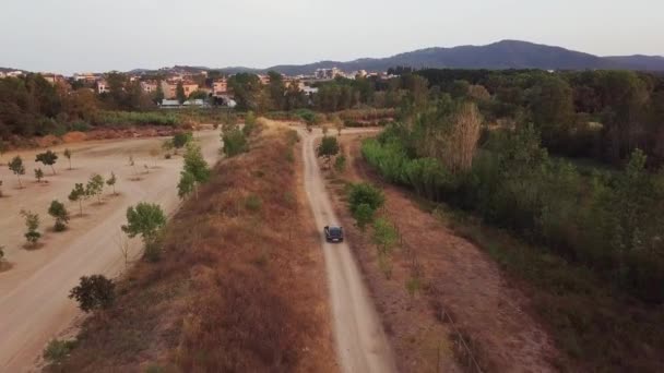 Aerial Done Shot Flying Forward Grey Car Driving Gravel Road — Stock videók