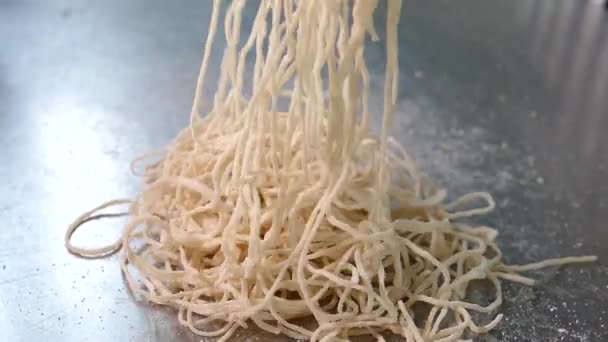 Close Footage Chef Scattering Egg Noodles Shiny Silver Table — Videoclip de stoc