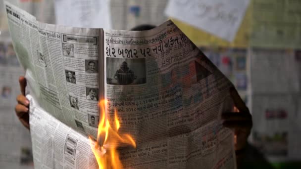 Man Holding Burning News Paper Hands — Stockvideo