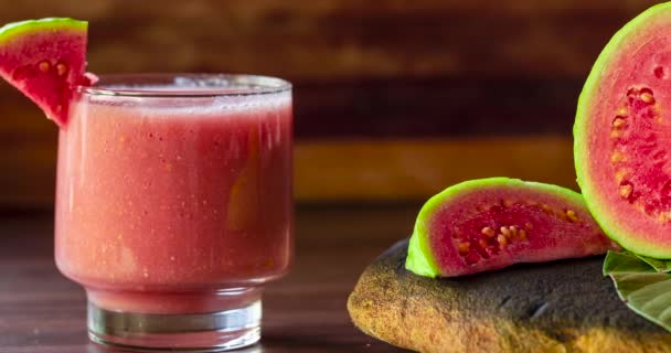Glass Red Guava Juice Sliced Guava Slice Wooden Background — Video