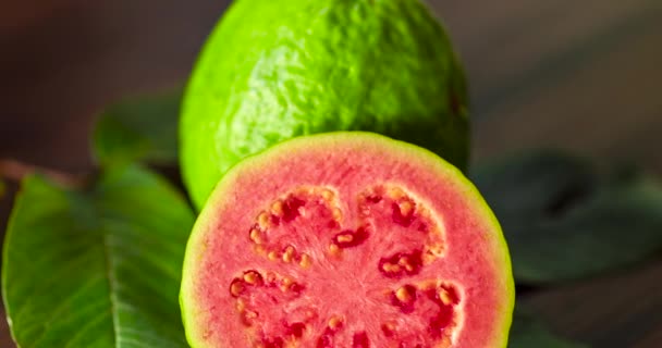 Closeup Sliced Red Guavas Wooden Background — Αρχείο Βίντεο