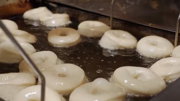 Cinematic Close Bakers Stick Flipping Batch Fresh Doughnuts Homemade Oil — ストック動画