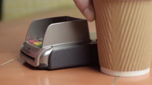 Hand Paying Card Take Out Coffee Cup Close Shot — Stockvideo